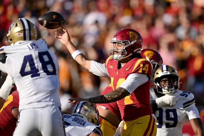 Oct 3, 2026; Los Angeles, California, USA;  USC Trojans quarterback Jayden Maiava (14) passes the ball against the Washington Huskies during the first quarter at United Airlines Field at Los Angeles Memorial Coliseum.  Mandatory Credit: Griffin Hooper-Imagn Images