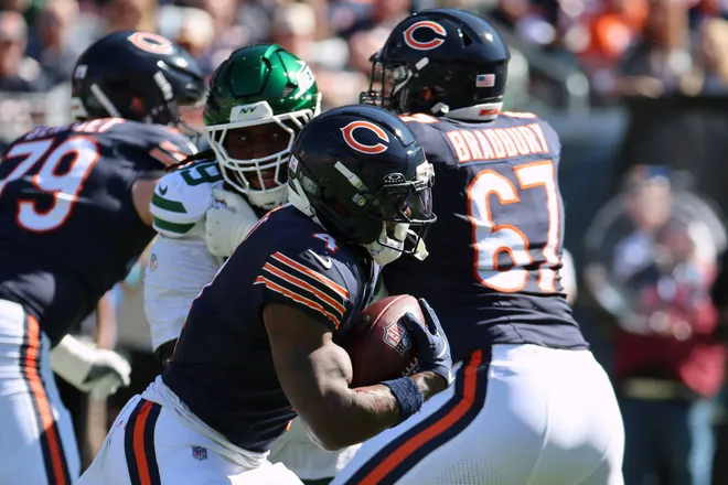Oct 4, 2026; Chicago, Illinois, USA;  Chicago Bears running back D'Andre Swift (4) runs with the ball against the New York Jets during the first quarter at Soldier Field.  Mandatory Credit: Mike Dinovo-Imagn Images
