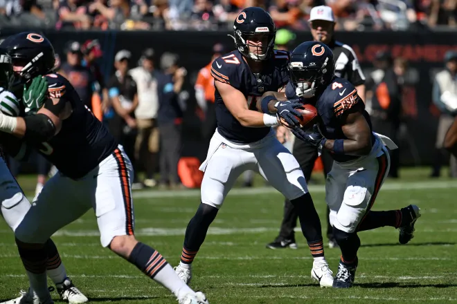 Oct 4, 2026; Chicago, Illinois, USA;  Chicago Bears quarterback Tyson Bagent (17) hands the ball off to running back D'Andre Swift (4) against the New York Jets during the first quarter at Soldier Field.  Mandatory Credit: Matt Marton-Imagn Images