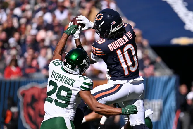 Oct 4, 2026; Chicago, Illinois, USA;  Chicago Bears wide receiver Luther Burden III (10) makes a catch for a first down against New York Jets safety Minkah Fitzpatrick (29) during the first quarter at Soldier Field.  Mandatory Credit: Matt Marton-Imagn Images