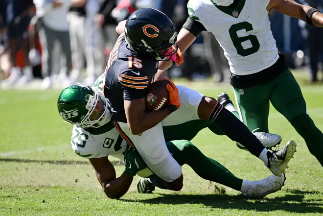 Oct 4, 2026; Chicago, Illinois, USA;  New York Jets safety Minkah Fitzpatrick (29) tackles Chicago Bears wide receiver Rome Odunze (15) during the second quarter at Soldier Field.  Mandatory Credit: Matt Marton-Imagn Images