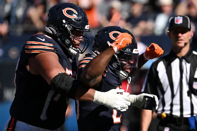 Oct 4, 2026; Chicago, Illinois, USA;  Chicago Bears running back Kyle Monangai (25) celebrates with offensive line Jonah Jackson (73) after a touchdown against the New York Jets during the third quarter at Soldier Field.  Mandatory Credit: Matt Marton-Imagn Images