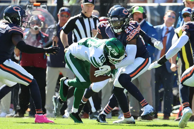 Oct 4, 2026; Chicago, Illinois, USA;  New York Jets wide receiver Isaiah Williams (18) runs with the ball against Chicago Bears defensive back Tyrique Stevenson (29) during the third quarter at Soldier Field.  Mandatory Credit: Mike Dinovo-Imagn Images