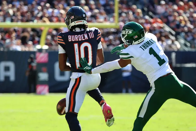 Oct 4, 2026; Chicago, Illinois, USA;  Chicago Bears wide receiver Luther Burden III (10) is unable to make a catch while defended by New York Jets cornerback Azareye'h Thomas (1) during the third quarter at Soldier Field.  Mandatory Credit: Mike Dinovo-Imagn Images