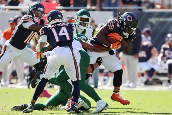 Oct 4, 2026; Chicago, Illinois, USA;  Chicago Bears running back Kyle Monangai (25) runs with the ball against New York Jets safety Dane Belton (6) during the third quarter at Soldier Field.  Mandatory Credit: Mike Dinovo-Imagn Images