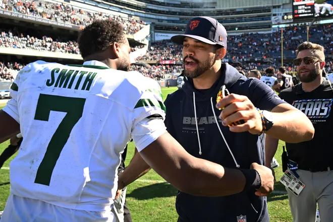 Oct 4, 2026; Chicago, Illinois, USA;  Chicago Bears quarterback Caleb Williams (18) hugs New York Jets quarterback Geno Smith (7) after the game at Soldier Field.  Mandatory Credit: Matt Marton-Imagn Images