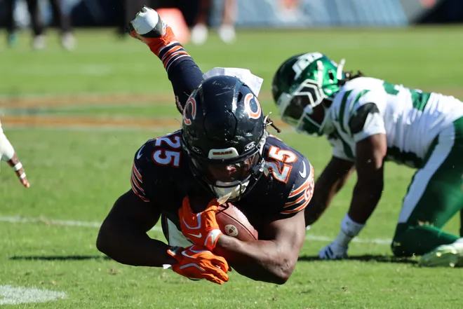 Oct 4, 2026; Chicago, Illinois, USA;  Chicago Bears running back Kyle Monangai (25) gets tripped up on a run against the New York Jets during the second half at Soldier Field.  Mandatory Credit: Mike Dinovo-Imagn Images
