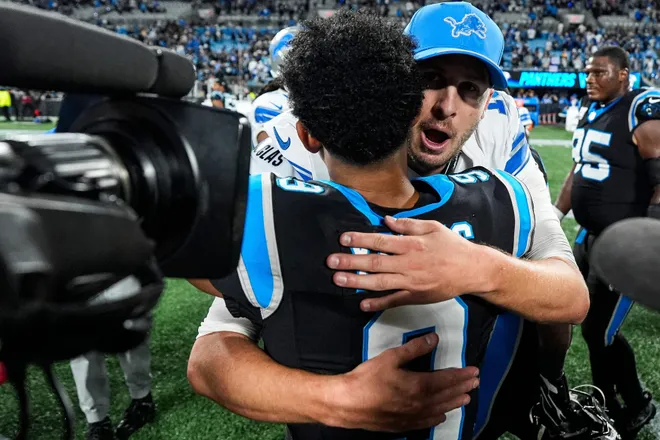 Detroit Lions quarterback Jared Goff (16) hugs Carolina Panthers quarterback Bryce Young (9) after a 32-26 loss to the Carolina Panthers at Bank of America Stadium in Charlotte on Sunday, Oct. 4, 2026.