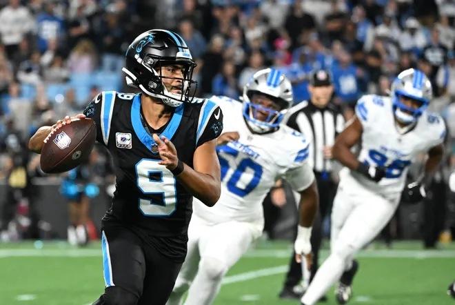 Oct 4, 2026; Charlotte, North Carolina, USA;  Carolina Panthers quarterback Bryce Young (9) scrambles with the ball against the Detroit Lions during the fourth quarter at Bank of America Stadium.  Mandatory Credit: Bob Donnan-Imagn Images