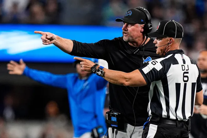 Detroit Lions head coach Dan Campbell talks to a referee after a play against Carolina Panthers during the first half at Bank of America Stadium in Charlotte on Sunday, Oct. 4, 2026.