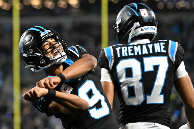 Oct 4, 2026; Charlotte, North Carolina, USA;  Carolina Panthers quarterback Bryce Young (9) celebrates after a touchdown by wide receiver Tetairoa McMillan (not pictured) against the Detroit Lions during the third quarter at Bank of America Stadium.  Mandatory Credit: Bob Donnan-Imagn Images
