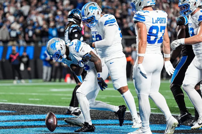 Detroit Lions running back Jahmyr Gibbs (0) celebrates scoring a touchdown against the Carolina Panthers during the first half at Bank of America Stadium in Charlotte on Sunday, Oct. 4, 2026.