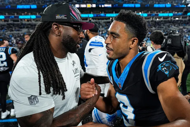 Detroit Lions defensive coordinator Kelvin Sheppard, left, shakes hands with Carolina Panthers quarterback Bryce Young (9) after a 32-26 loss to the Carolina Panthers at Bank of America Stadium in Charlotte on Sunday, Oct. 4, 2026.