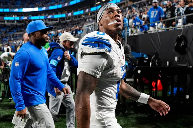 Detroit Lions running back Jahmyr Gibbs (0) next to running backs coach Tashard Rice walks off the field after a 32-26 loss to the Carolina Panthers at Bank of America Stadium in Charlotte on Sunday, Oct. 4, 2026.