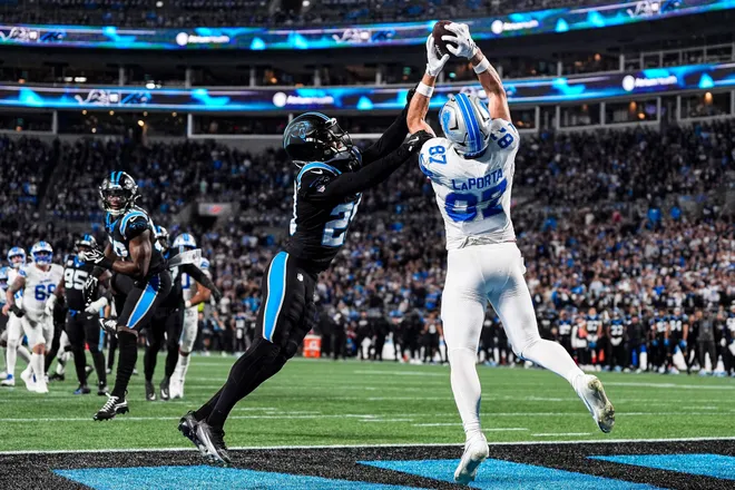 Detroit Lions tight end Sam LaPorta (87) catches a touchdown pass from Carolina Panthers cornerback Akayleb Evans (29) in the second half at Bank of America Stadium in Charlotte on Sunday, Oct. 4, 2026.