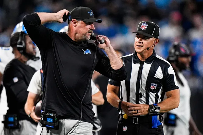 Detroit Lions head coach Dan Campbell talks to a referee after a play against the Carolina Panthers during the first half at Bank of America Stadium in Charlotte on Sunday, Oct. 4, 2026.